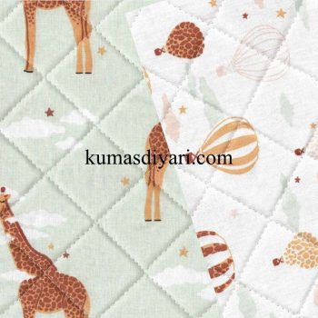 giraffe and balloon themed quilted fabric