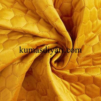 gold-colored beehive quilted fabric