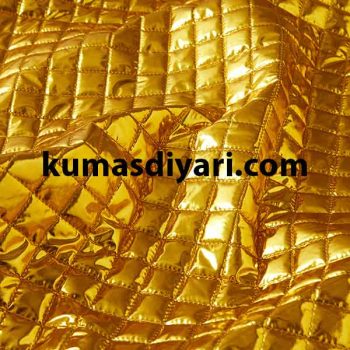 gold-colored square quilted fabric for a coat